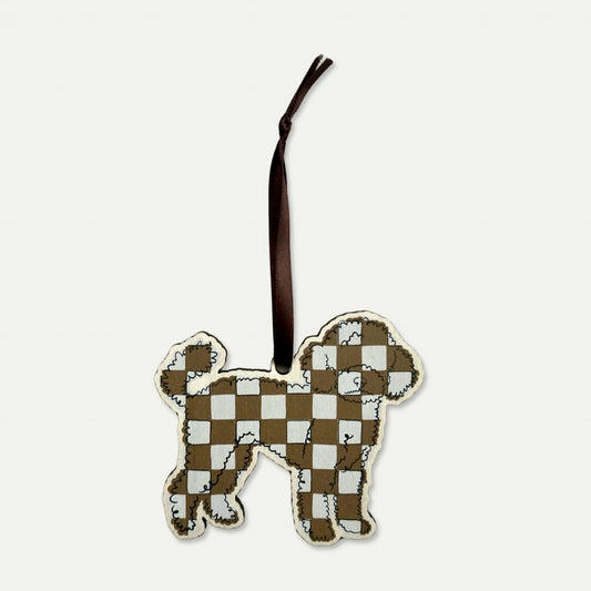 Checkered dog-shaped ornament on a white background with chocolate brown satin ribbon
